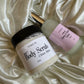 Two skincare products on a satin surface